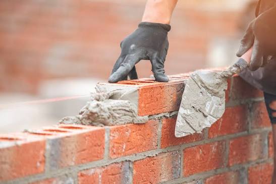 Neatly laid red brick wall showing quality workmanship